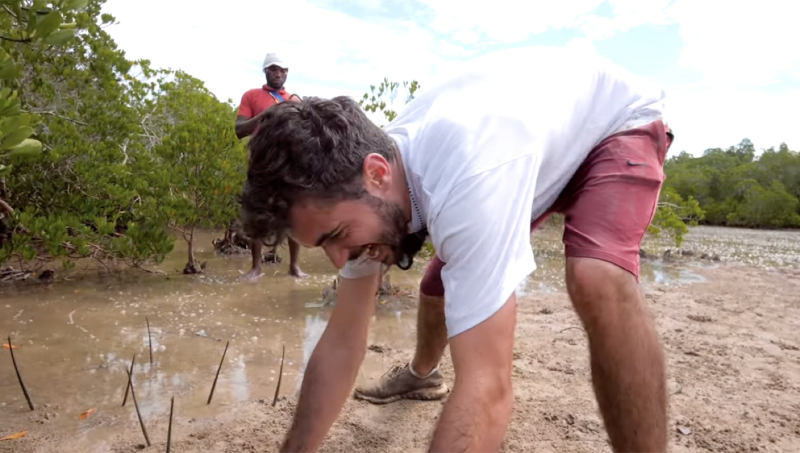 Jimi Cohen planting mangroves in Kenya